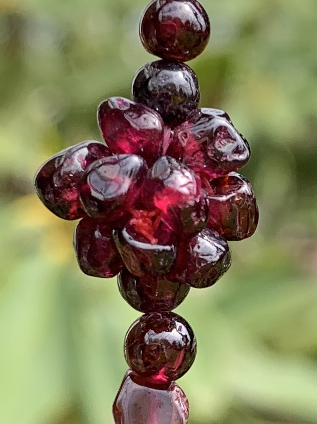 Garnet clusters separated by round and diamond shaped beads